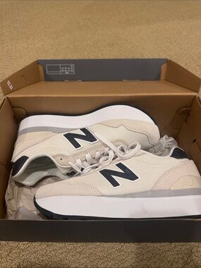 New Balance Women’s Beige and Black Low-Top Sneakers